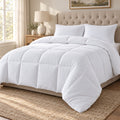 White box stitched queen down alternative comforter on a made bed