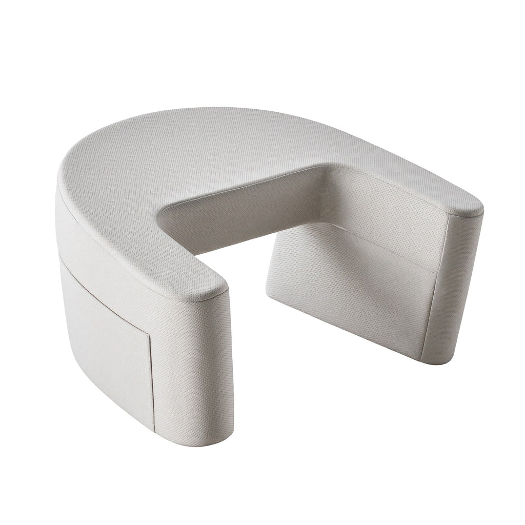 Light grey U-shaped reading pillow with arms on a white background